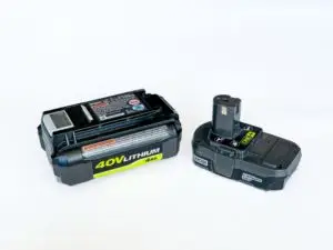Two rechargeable lithium-ion batteries of different sizes on a white background, probably designed for use with power tools or garden equipment.